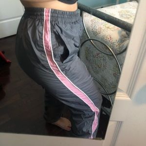 Grey track pants with pink and white stripes